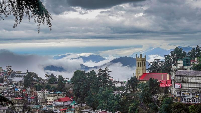 Low clouds cover the mountains after rainfall, in Shimla on Thursday.