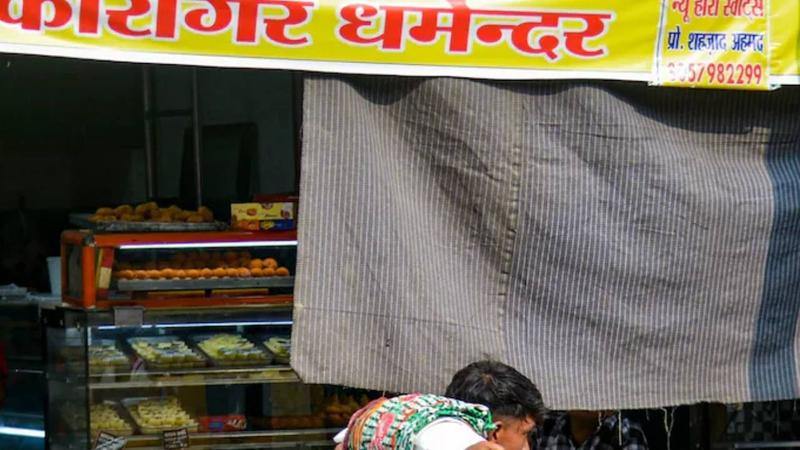 shopkeepers display their names and contact numbers