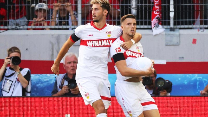 Stuttgart's Ermedin Demirovic, right, celebrates scoring with teammate Atakan Karazor during the Bundesliga soccer match between SC Freiburg and VfB Stuttgart at Europa-Park Stadium, Freiburg, Germany, Saturday Aug. 24, 2024.