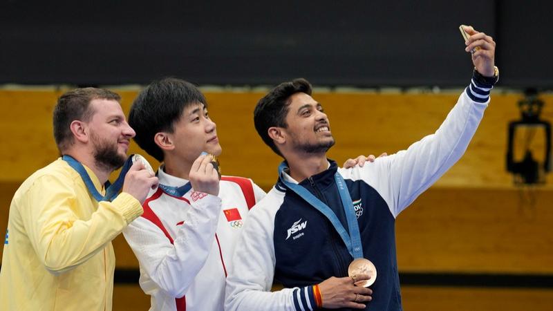 Swapnil Kusale celebrates with Bronze Medal on Olympics Podium