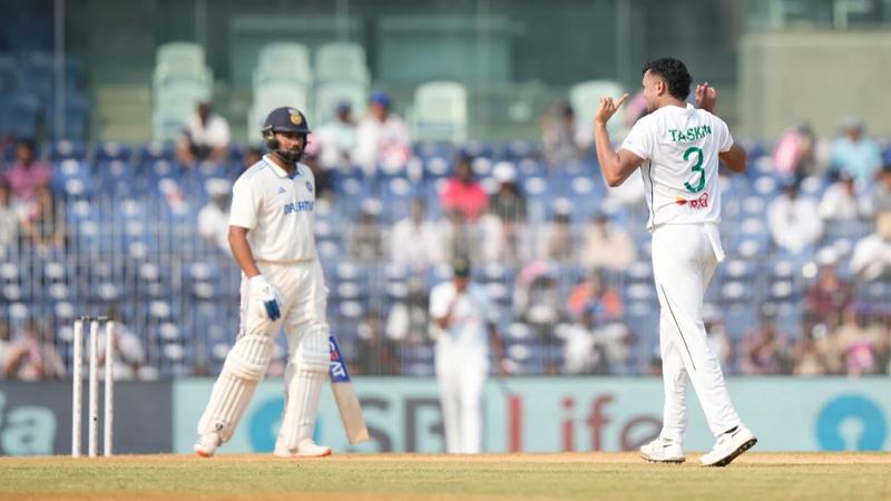 Taskin Ahmed celebrates Rohit Sharma's wicket.