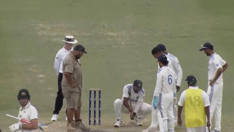 team india a players mukesh kumar repairing pitch during match against australia a