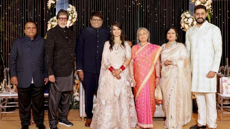 The Bachchan family pose at a wedding reception