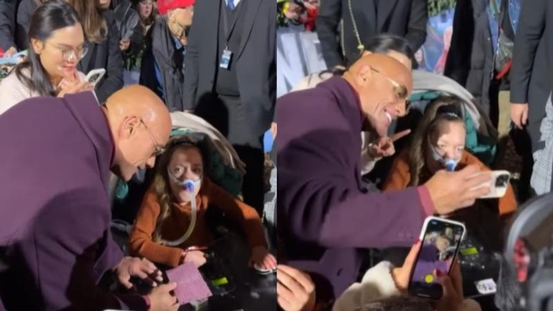 The Rock greets his special fan at an event