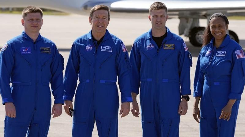  Three NASA astronauts whose prolonged space station mission ended with a trip to the hospital last month declined to say Friday which one of them was sick.