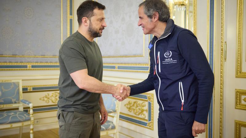 Ukrainian President Volodymyr Zelenskyy shakes hands with Director General of the International Atomic Energy Agency (IAEA), Rafael Mariano Grossi in Kyiv, Ukraine on Tuesday