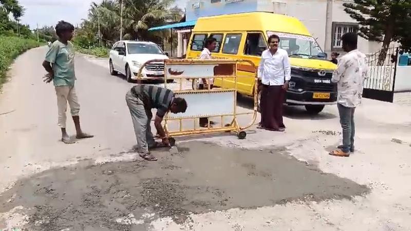 Vinod Raj spotted assisting lqabooures filling potholes.