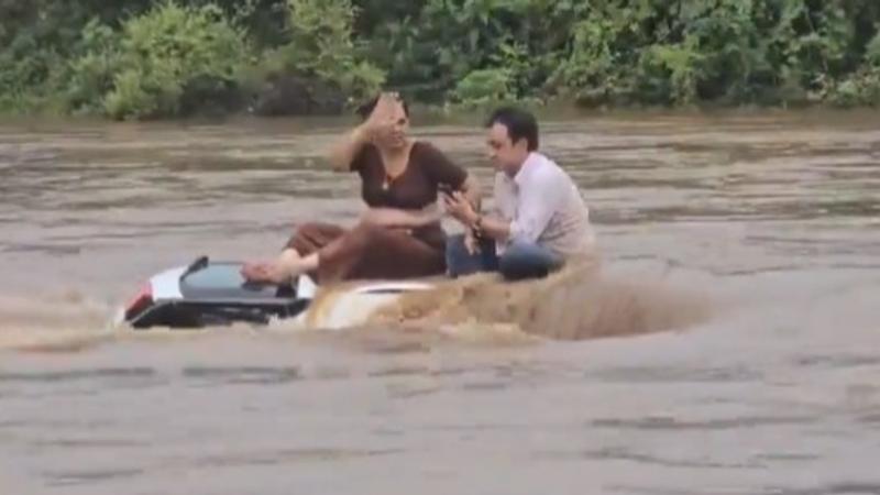 Viral Video Shows Couple Relaxing Atop Car Stuck In Floodwaters