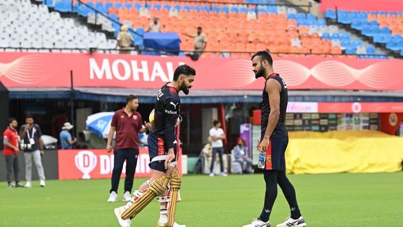 Virat Kohli and Akash Deep in RCB nets