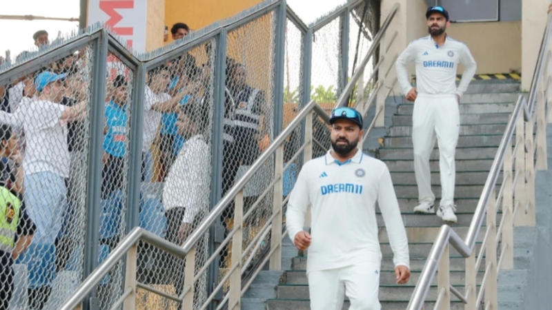 Virat Kohli and Rohit Sharma walk down the Wankhede stairs after loss to New Zealand in the third and the final Test