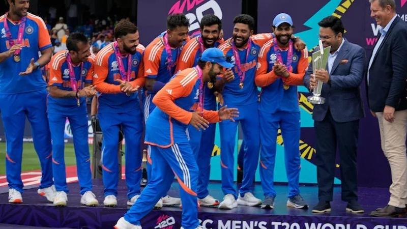 Rohit Sharma emulates Lionel Messi's Iconic FIFA WC celebration as India lift T20 WC trophy. 