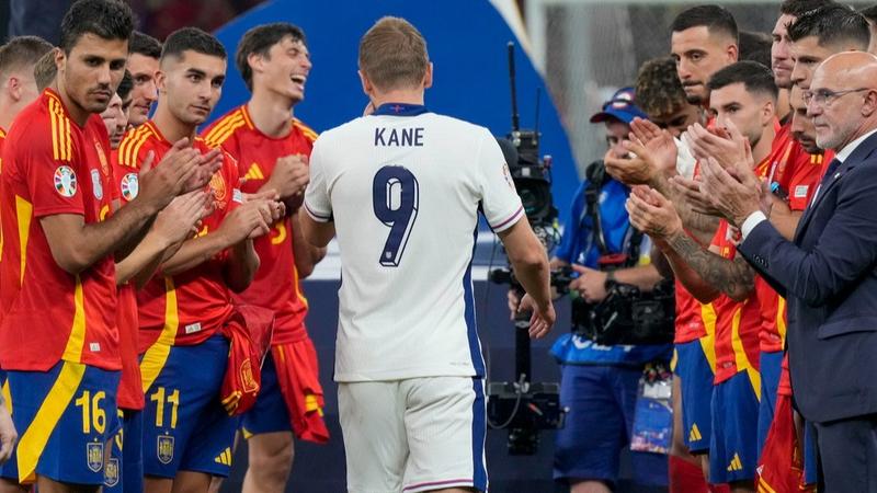 England Captain Harry Kane Walks As Spain Players Celebrate Around Him.