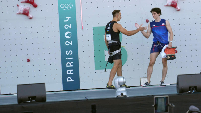 Yaroslav Tkach of Ukraine, left, shakes hands with Sam Watson of the United States at Paris Olympics