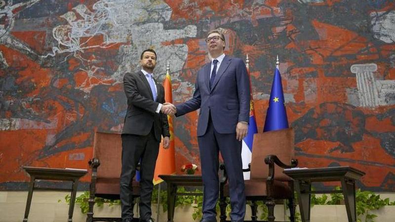 Montenegro's President Jakov Milatovic, left, shakes hands with his Serbian counterpart Aleksandar Vucic at the Serbia Palace in Belgrade, Serbia