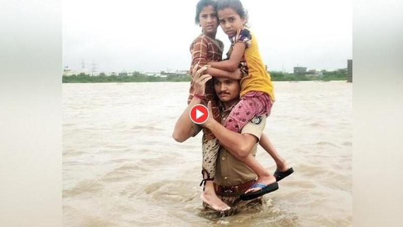 Gujarat Floods: CM Vijay Rupani hails heroic policeman for daring retrieval, netizens notice rescued girls' confidence in him