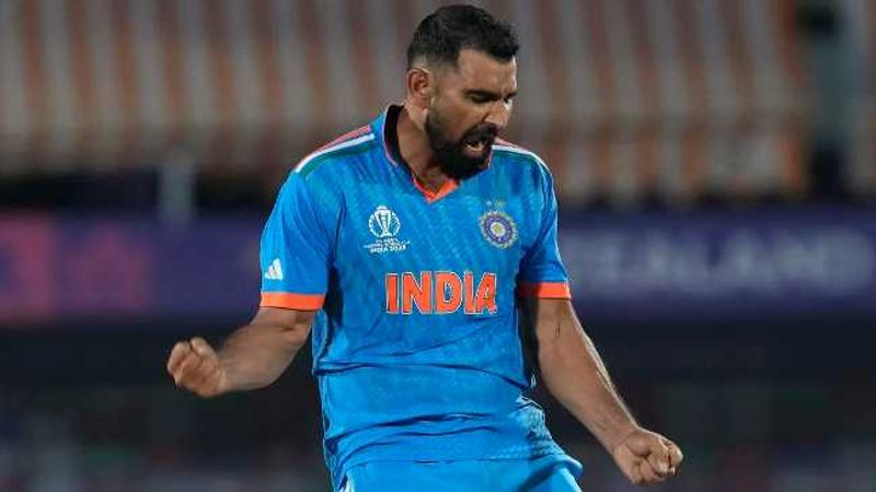 Mohammed Shami celebrates after he knocks off Mitchell Santner 