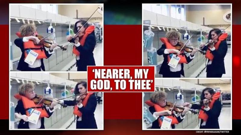 Coronavirus: violinists play Titanic hymn in empty aisle, watch video