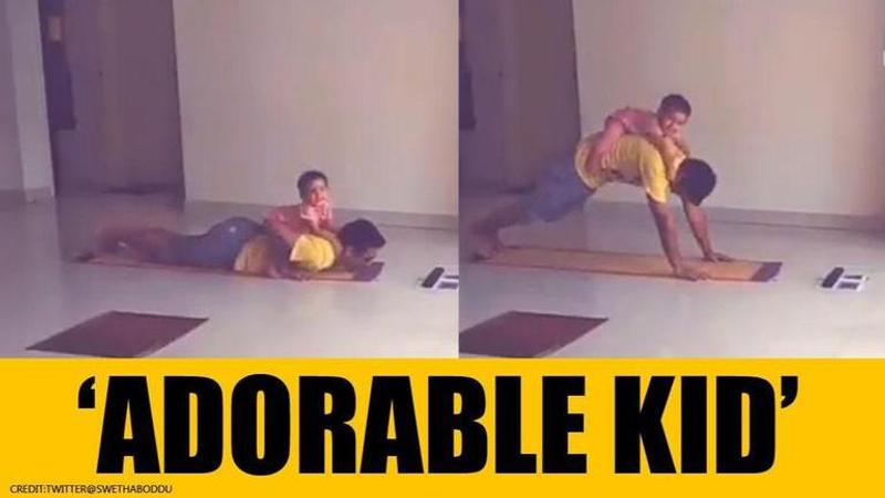 'Father's day special': Toddler 'adorably' hinders father as he performs yoga. Watch.