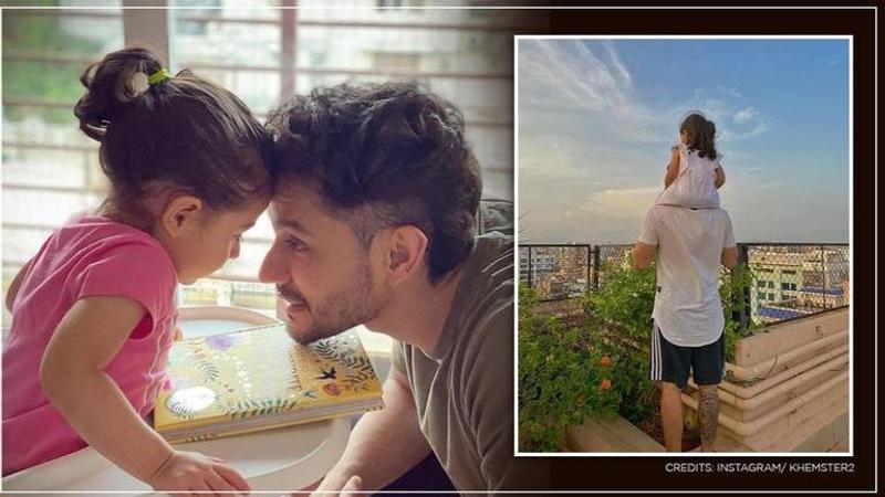 Inaaya Naumi Kemmu enjoys weather on dad Kunal Kemmu's shoulder. See Photo