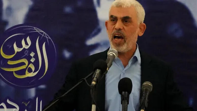 Yahya Sinwar, head of Hamas in Gaza, delivers a speech during a meeting with people at a hall on the sea side of Gaza City, April 30, 2022