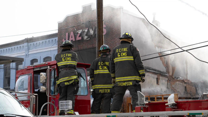Firefighters stand at the site of explosions that rocked Washington DC