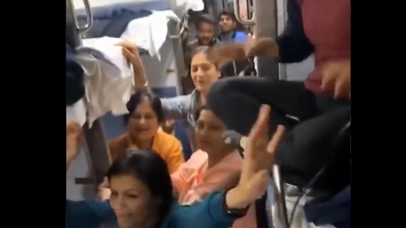 Passengers on a train, celebrating Ram Mandir inauguration