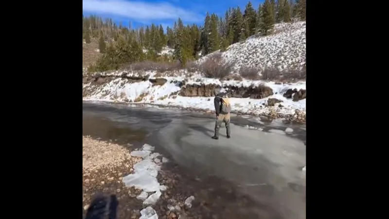 Man floats in river while standing on top of thin ice 