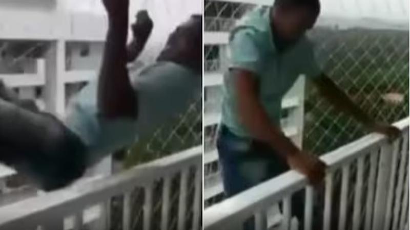 Man Tests Children's Safety Net with Daring Balcony Stunt