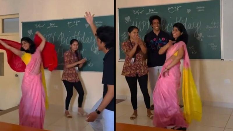  Teacher dances to "Kajra Re" in classroom.