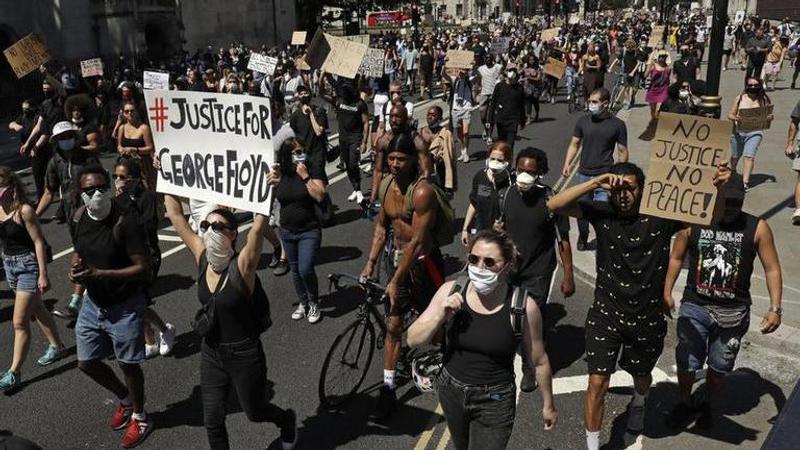 Mounted police charge protesters in London