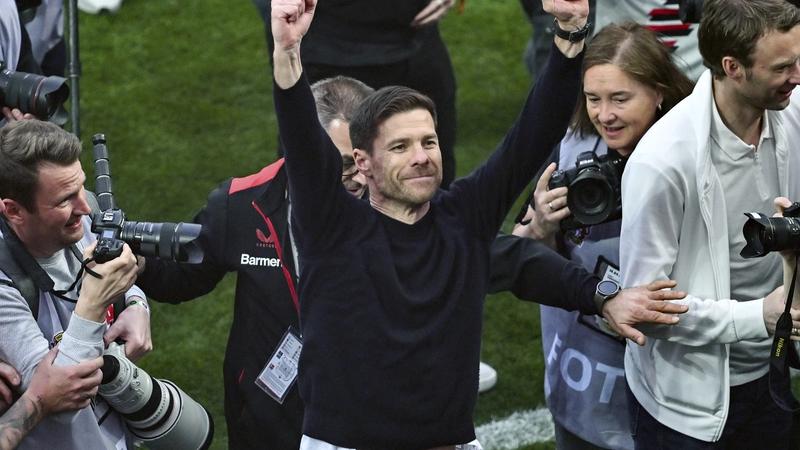 Xabi Alonso celebrates Bundesliga triumph