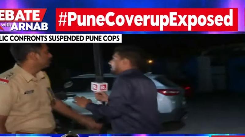 The reporter was pushed away by Assistant Police Inspector Rahul Jagdale as the former was trying to get the cop's reaction.