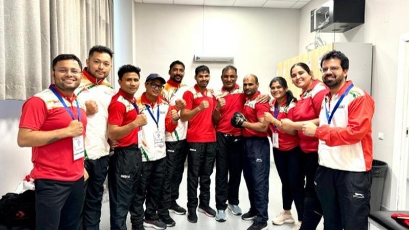 India's Abhishek Yadav with his team