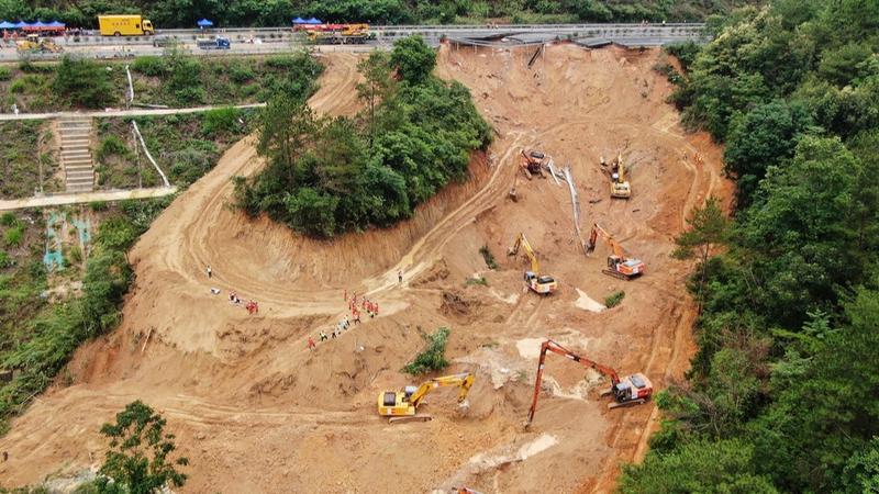 After the collapse of a bridge section in southern China, dozens of vehicles were sent tumbling down the steep slope. 