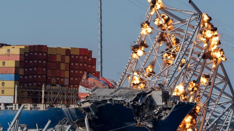 Explosive charges being detonated to remove the collapsed section of the Francis Scott Key bridge. 