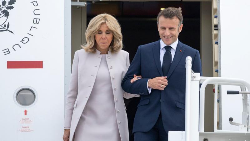 French President Emmanuel Macron arriving in Berlin alongside First Lady Brigitte Macron. 