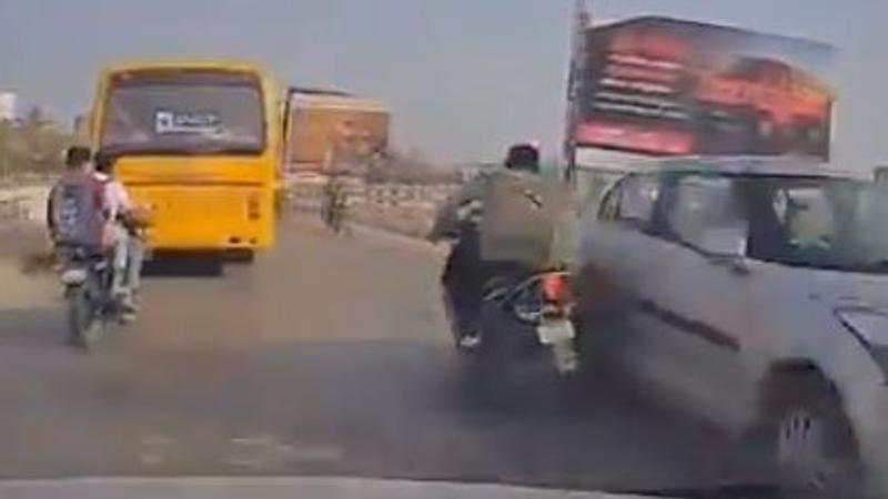 Biker Narrowly Escapes Death