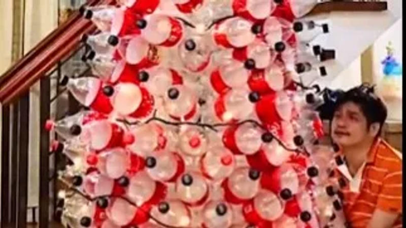 Man created Christmas tree with plastic bottles 