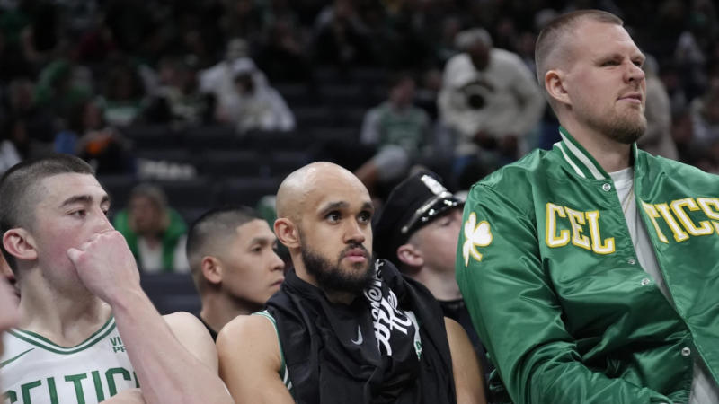 Boston Celtics' Payton Pritchard, Derrick White and Kristaps Porzingis watch their team struggle 