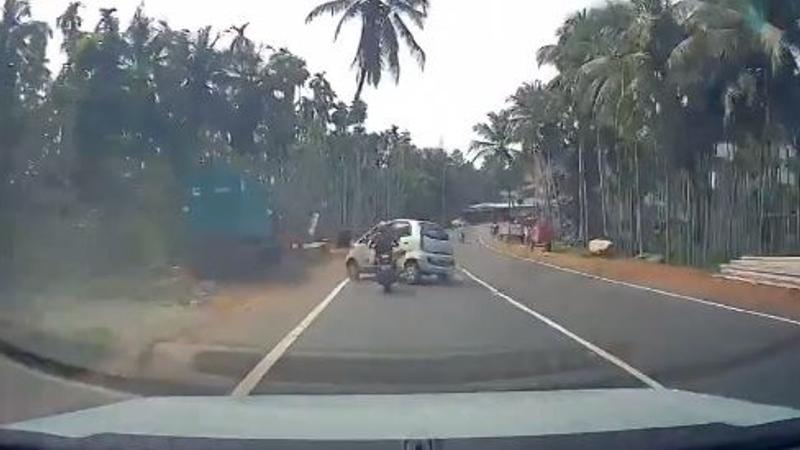 Careless Nano Driver Hits Biker On Road