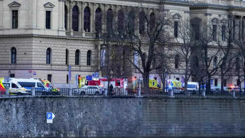 Police officers secure area surrounding Charles University after a gunman killed 14 people in Prague
