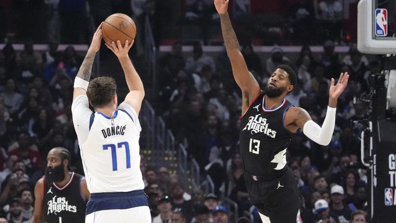 Dallas Mavericks' Luka Doncic in action against Paul George and LA Clipper