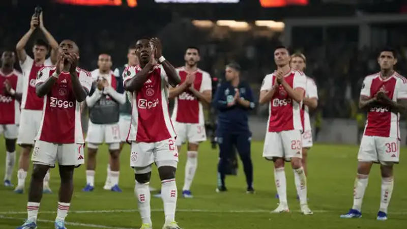 Ajax football team applaud fans