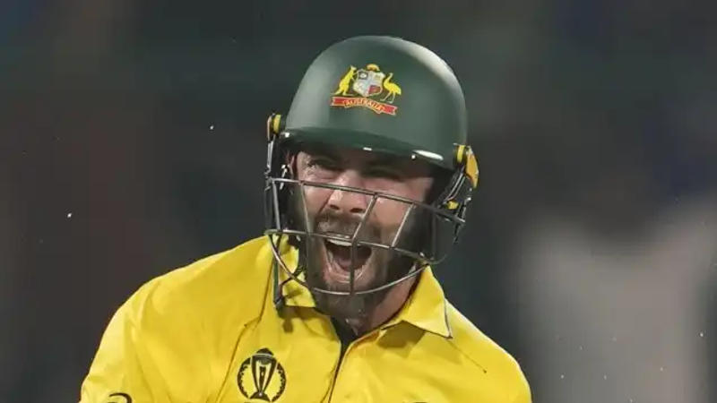 Glenn Maxwell reacts after reaching his century