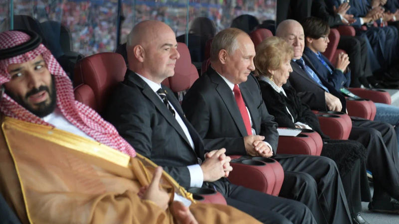 FIFA President Gianni Infantino, Saudi Arabia's Crown Prince Mohammed Bin Salman, and Russian President Vladimir Putin watch a FIFA World Cup 2018 match