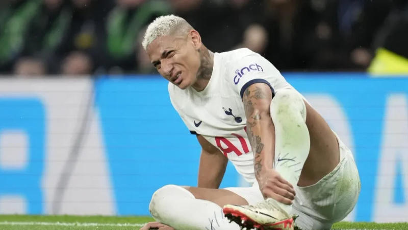 Tottenham’s Richarlison sits on the pitch in pain during the English Premier League soccer match between Tottenham Hotspur and Fulham at the Tottenham Hotspur Stadium.