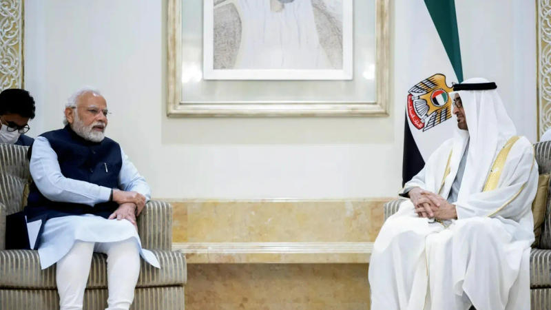  President of the United Arab Emirates Sheikh Mohamed bin Zayed Al Nahyan, right, receives the Prime Minister of India Narendra Modi at the Presidential Airport, in Abu Dhabi