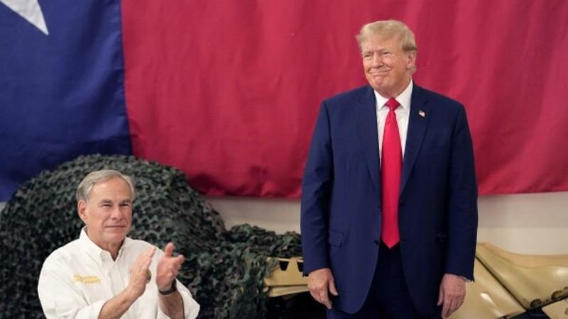  Republican presidential candidate and former President Donald Trump, right, is introduced by Texas Gov. Greg Abbott at the South Texas International Airport