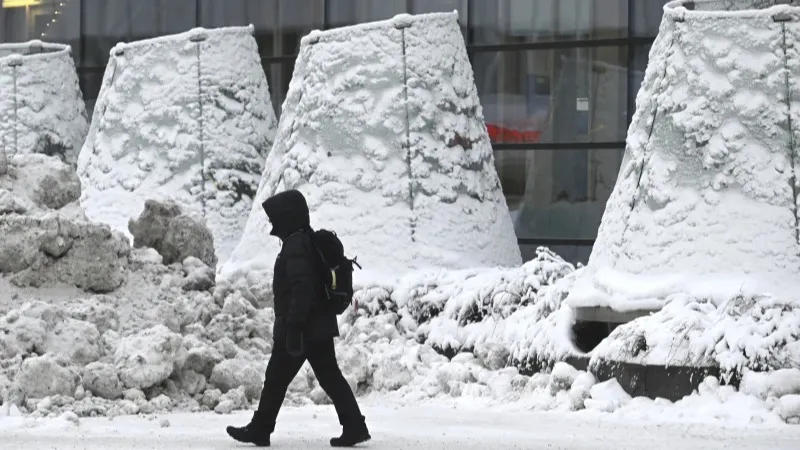 A man walks on the street in freezing temperatures in Helsinki, Wednesday, Jan. 3, 2024. Finland is experiencing cold weather with -40c degrees in the North Finland and capital Helsinki with -15c degrees.