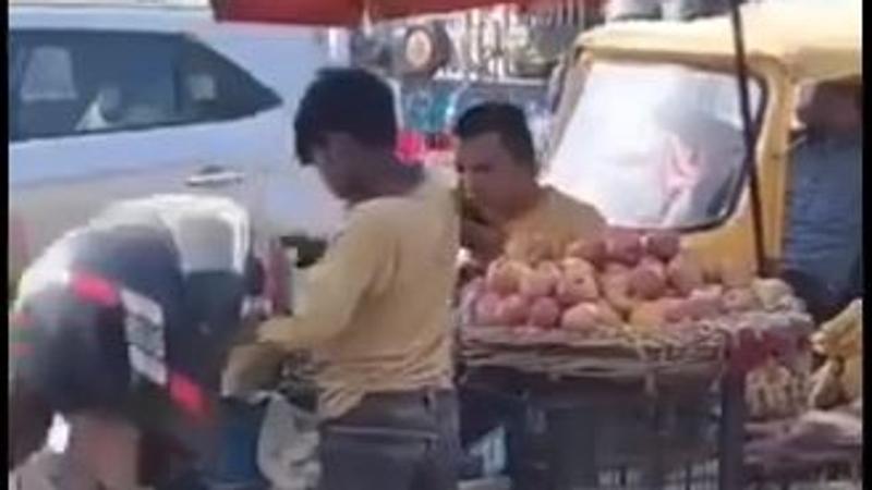 Greater Noida: Fruit seller applying saliva on fruits before selling them to customers